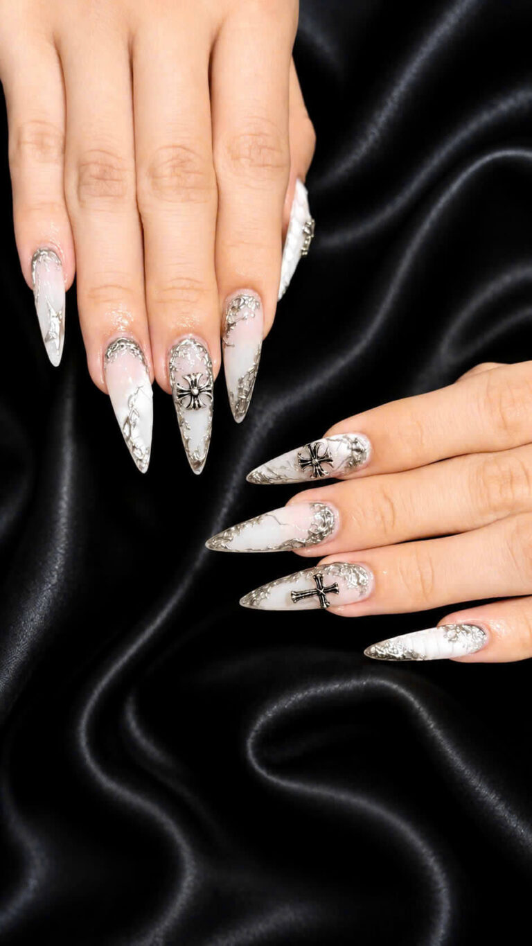Silver glitter manicure on a black satin background